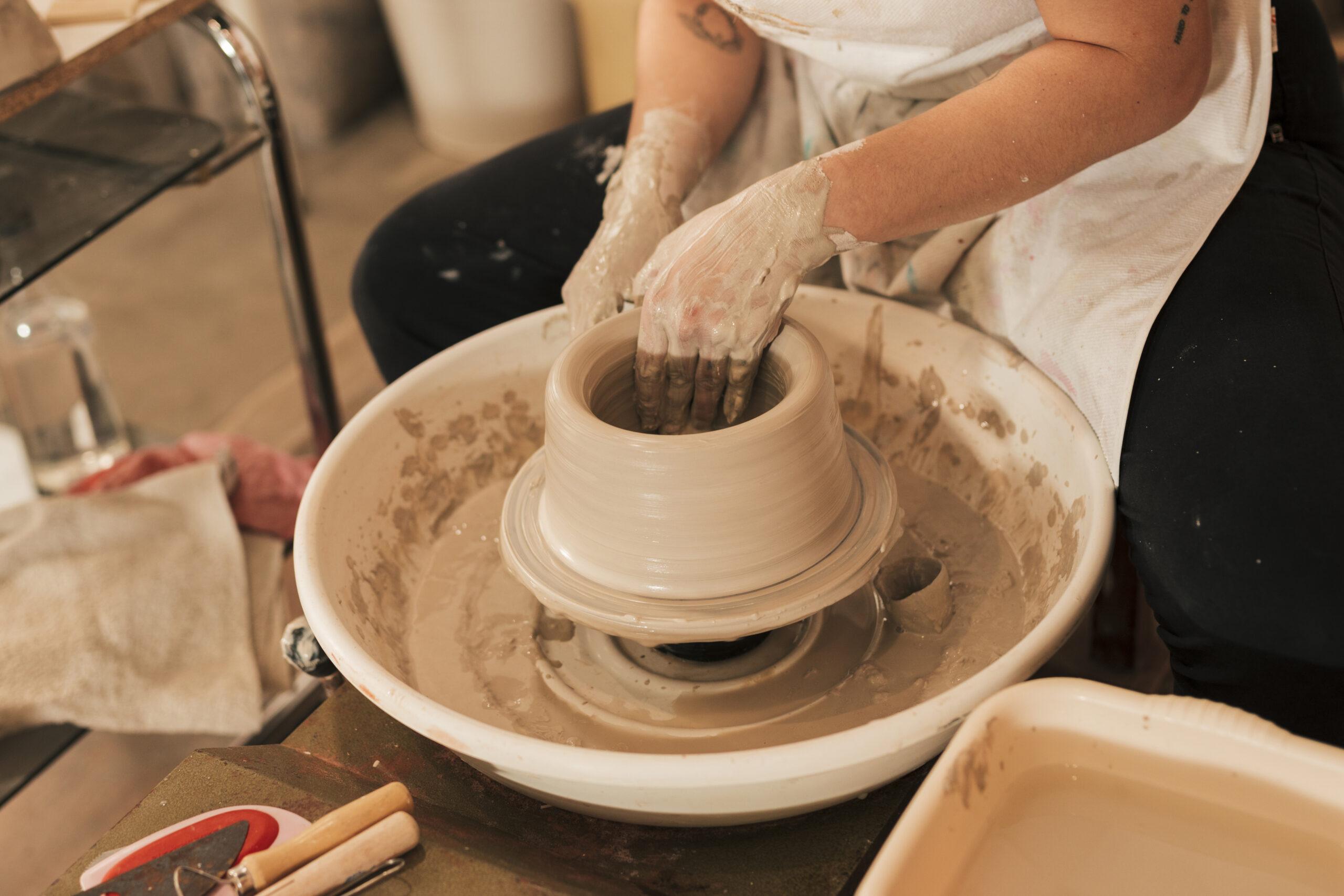 pixabay-close-up-female-hands-making-pottery-wheel